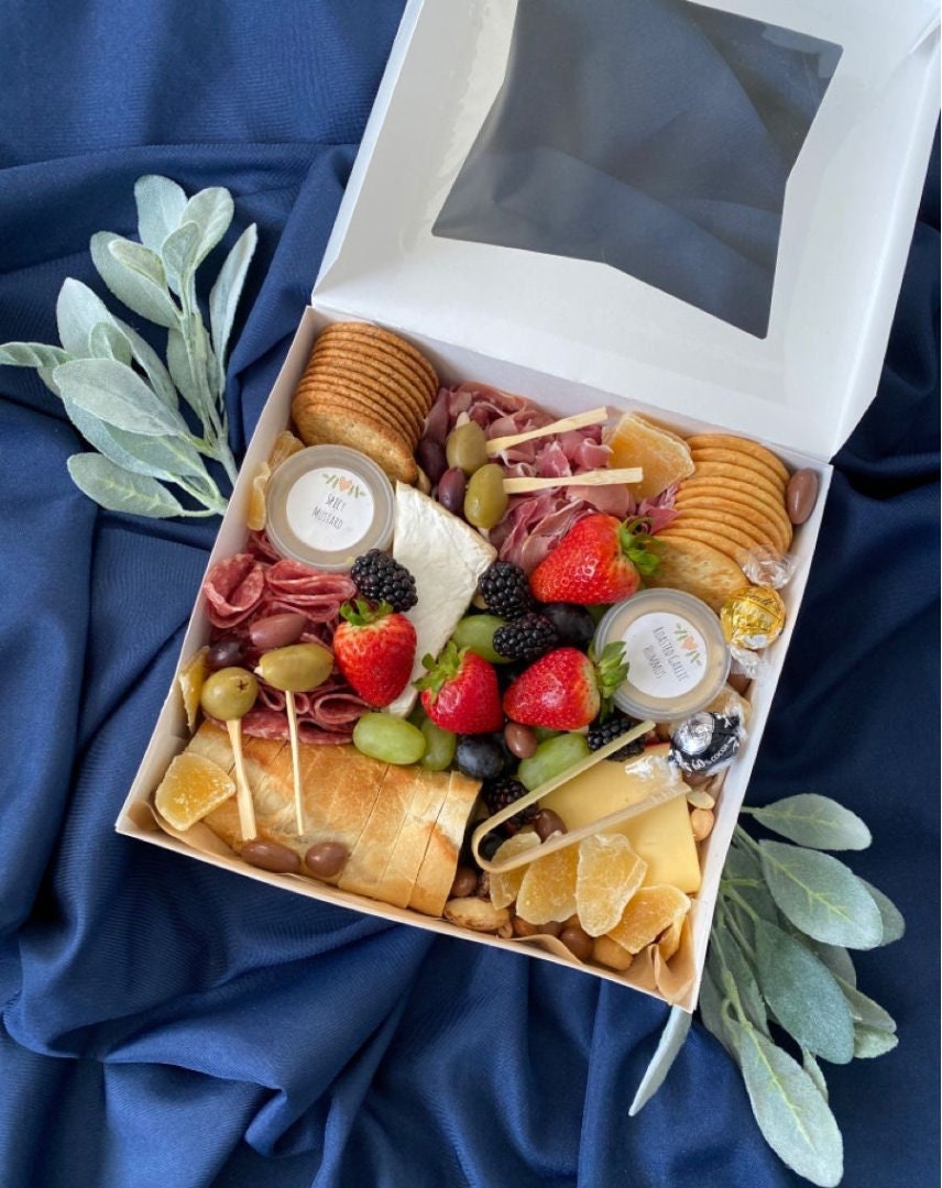 Individual square charcuterie box with clear window filled with meats, cheeses, and fruit – 6x6x3 inch grazing box