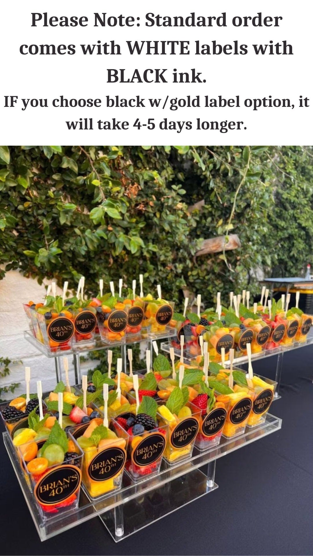 Charcuterie cups arranged with meats, cheese, and fruits.