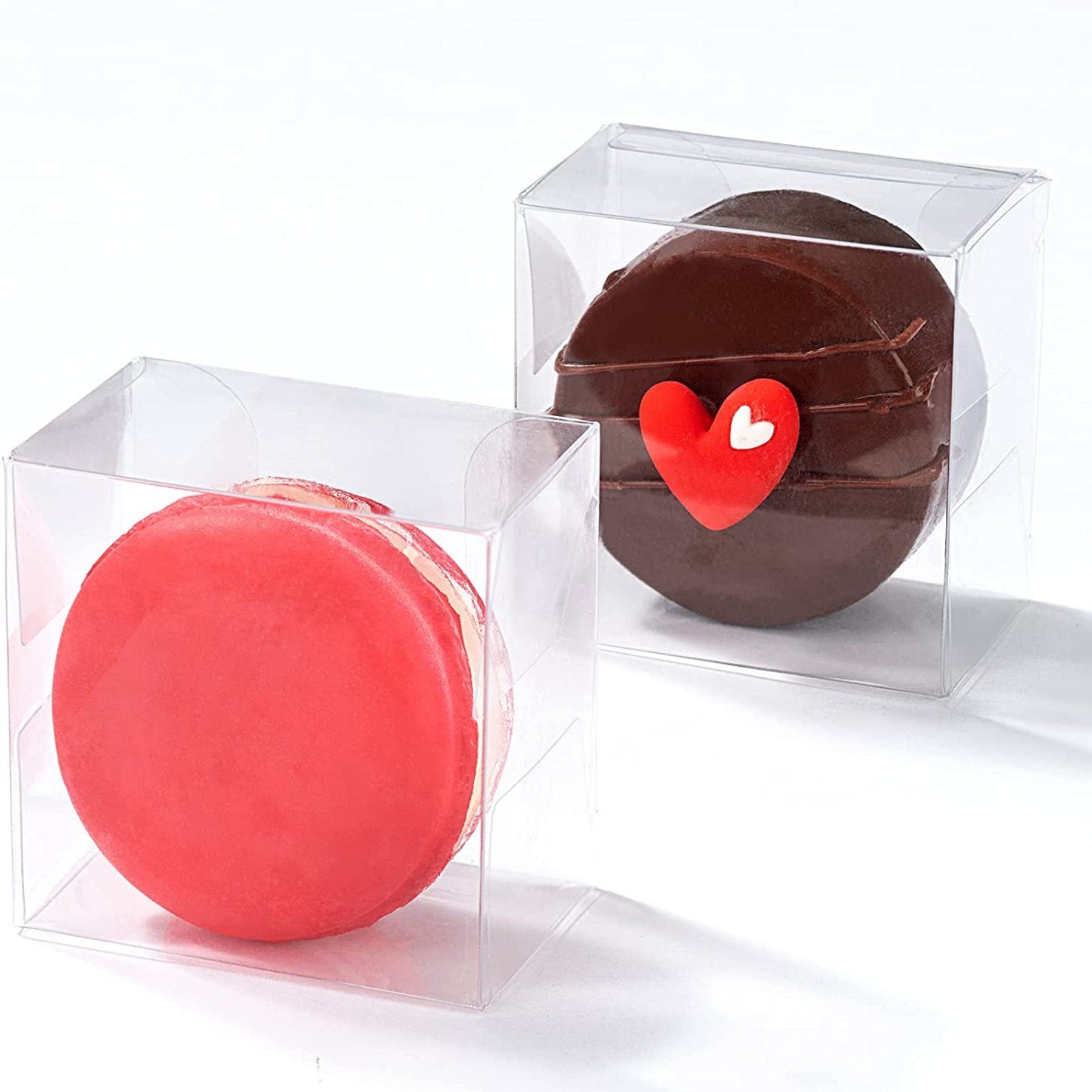 Clear PET cube macaroon box displaying a single pink macaron and a chocolate Oreo