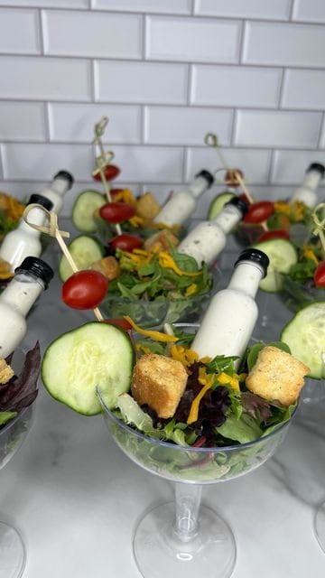 Clear acrylic salad cups for appetizer spread