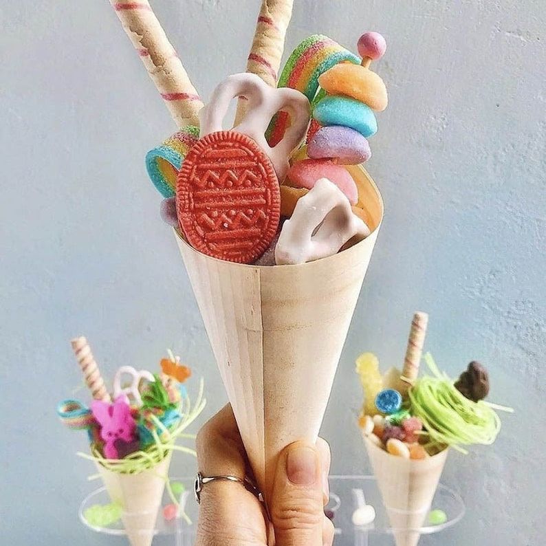 Bamboo cone with colorful desserts and candy sticks for party display