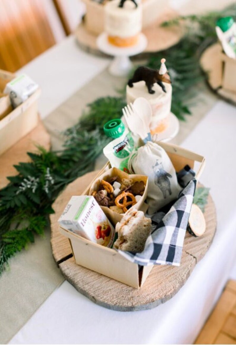 Disposable wooden charcuterie cups with various cheeses, meats, and crackers. Eco-friendly appetizer cones.