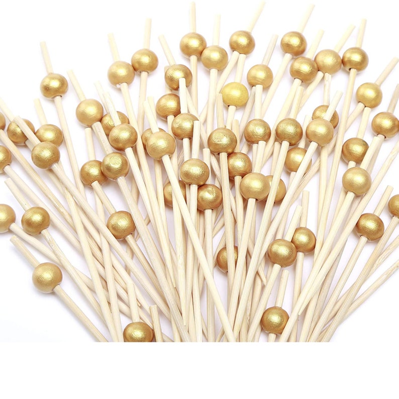 Gold pearl-topped toothpicks included with acrylic charcuterie stand set