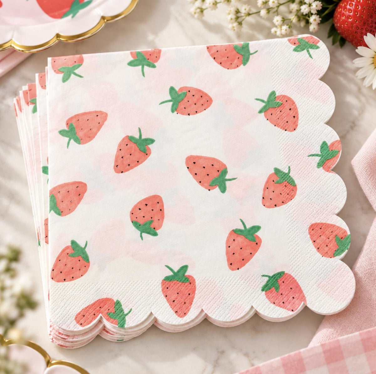 Girls strawberry birthday party supplies with coordinated disposable tableware for a cute party setup