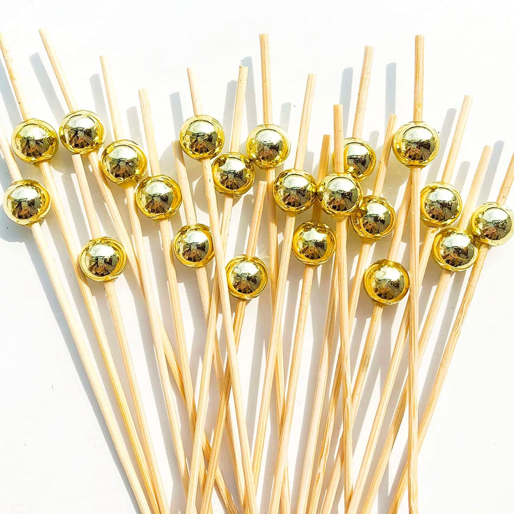 Set of gold fancy toothpicks for charcuterie, appetizers, and party displays