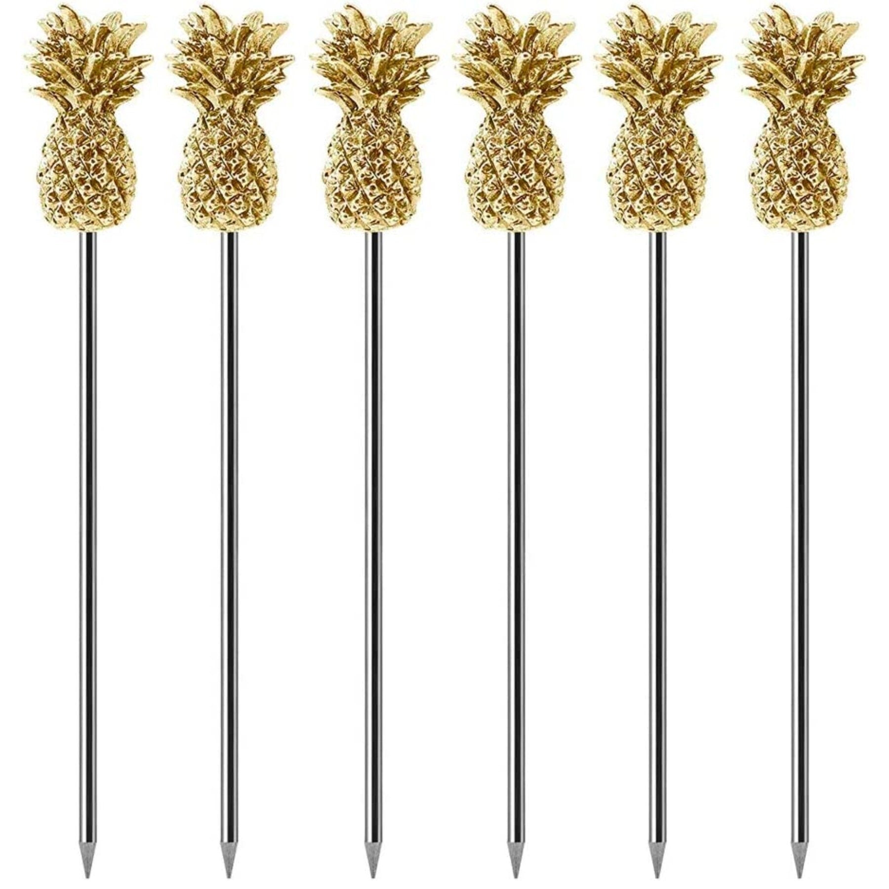 Six gold-top pineapple stainless steel drink stirrers lined up