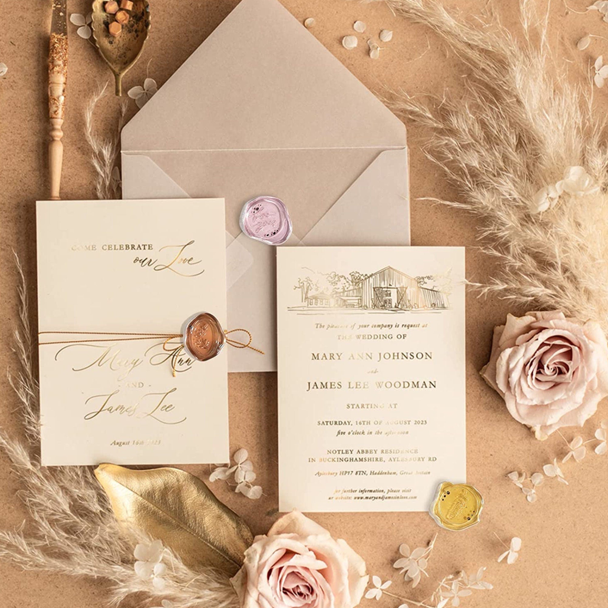 Neutral wedding invitation suite finished with a gold adhesive wax seal sticker.
