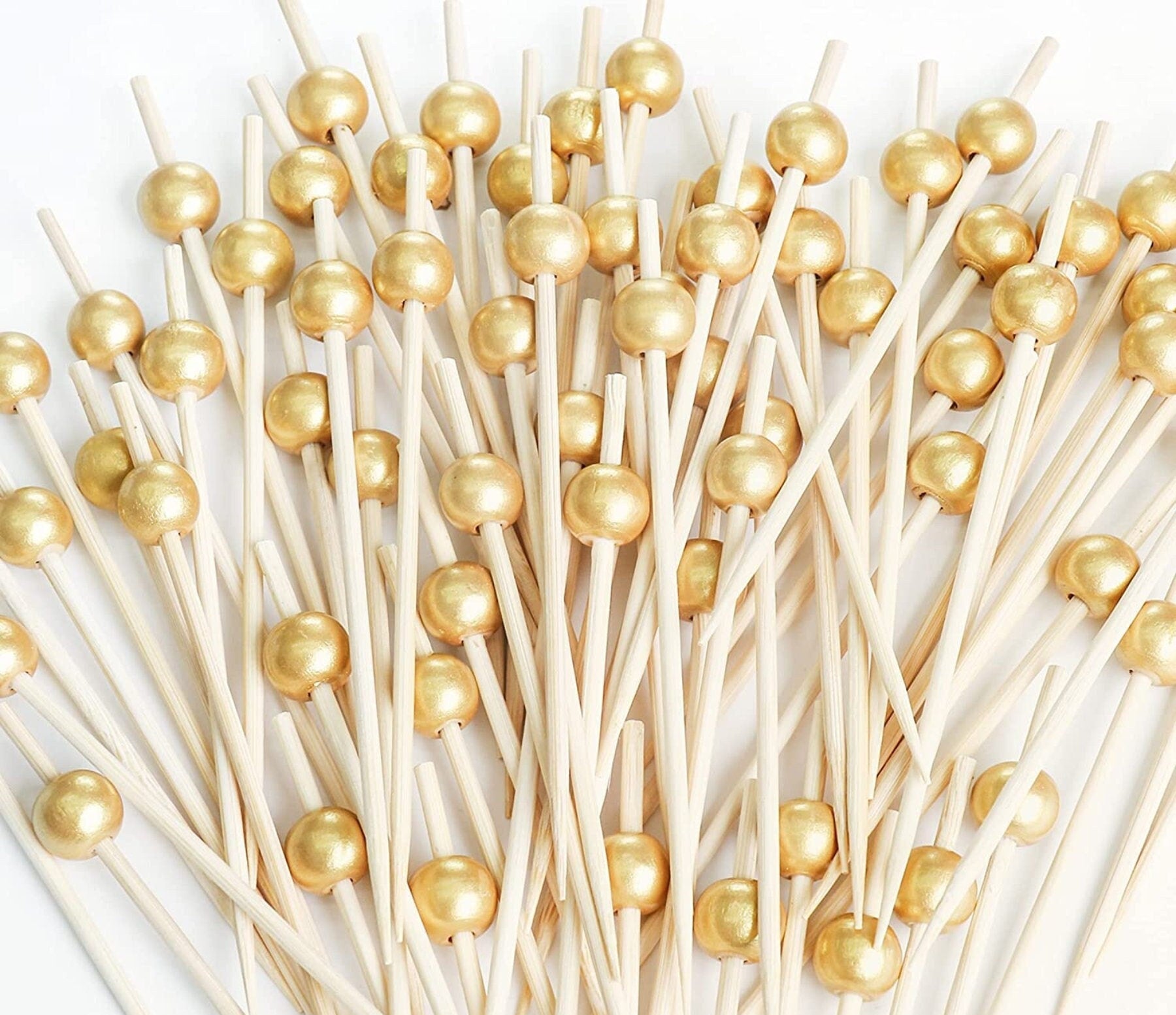 Gold pearl fancy toothpicks for appetizers and charcuterie.