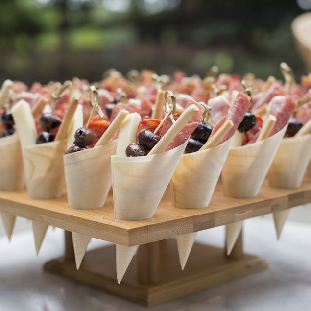 Tray of bamboo charcuterie cones filled for grazing table setup
