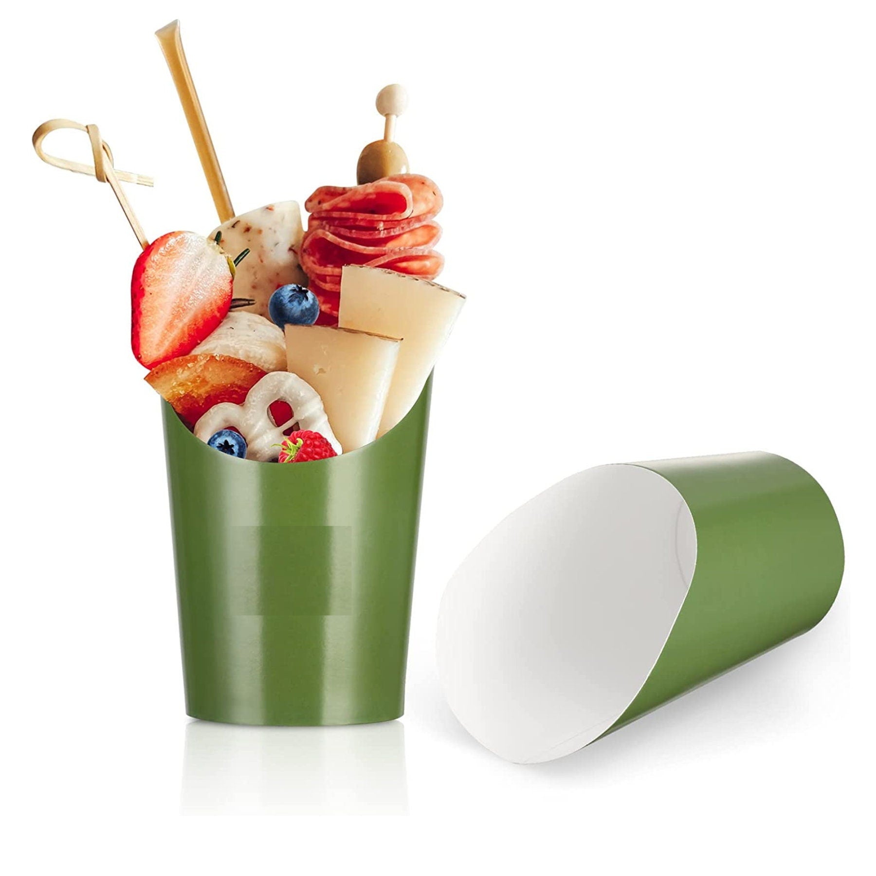 Green charcuterie cup filled with cheese, meats, strawberries, and snacks.