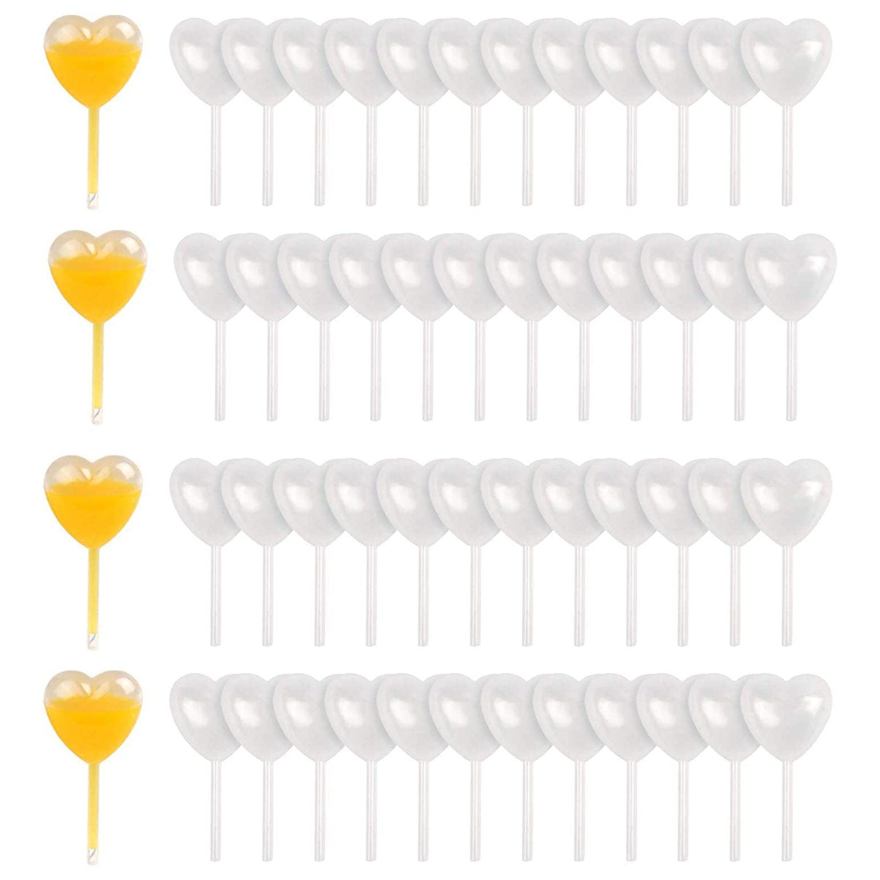 Heart-shaped clear mini pipettes arranged in rows for party desserts