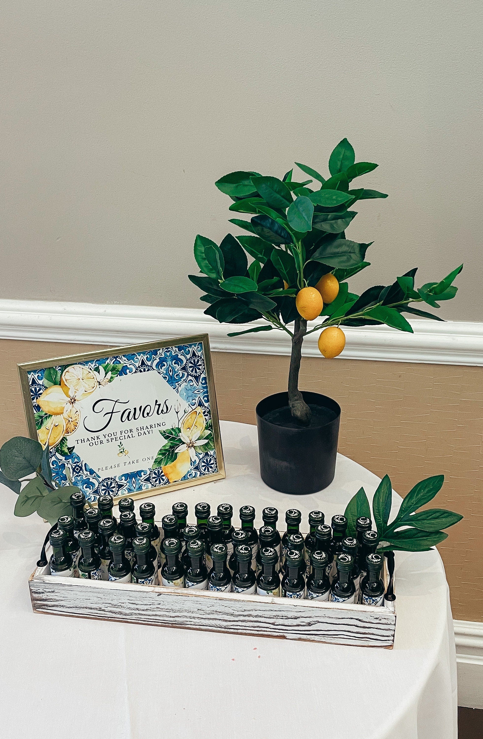 Lemon Italian themed favor table with editable sign and greenery