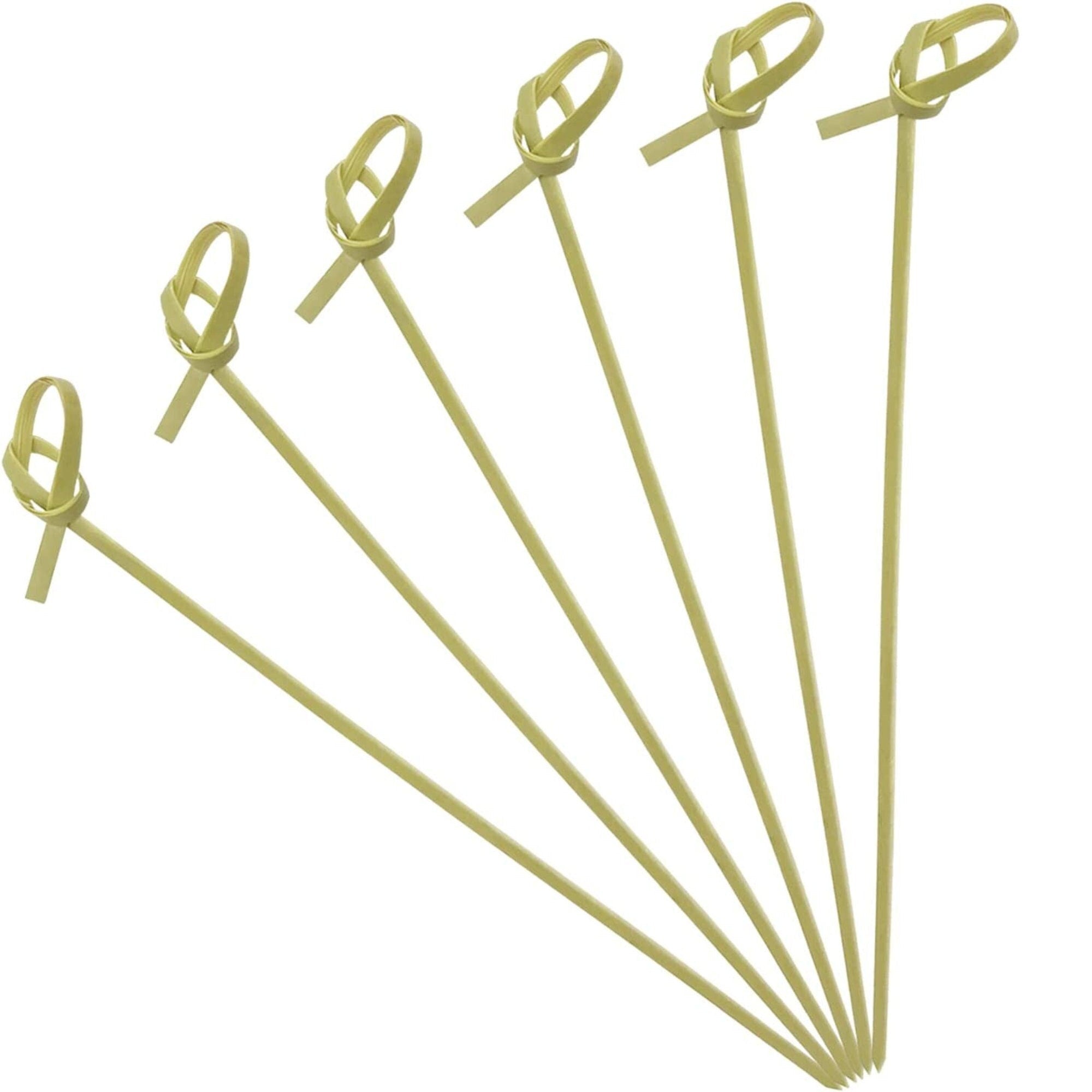 Knotted bamboo charcuterie toothpicks laid out for display