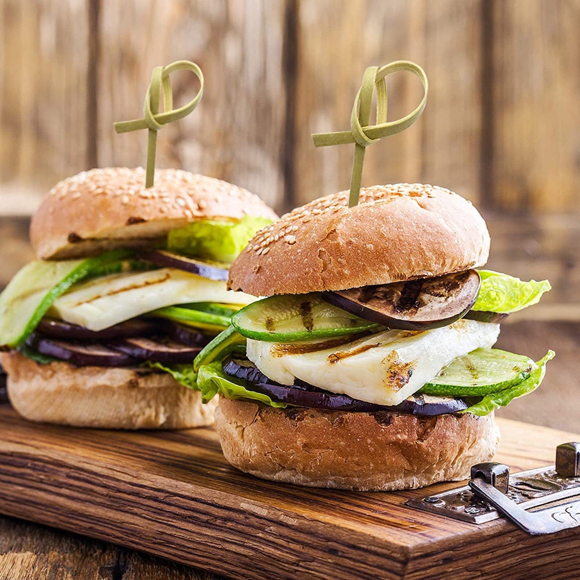 Mini burgers held together with knotted bamboo charcuterie toothpicks