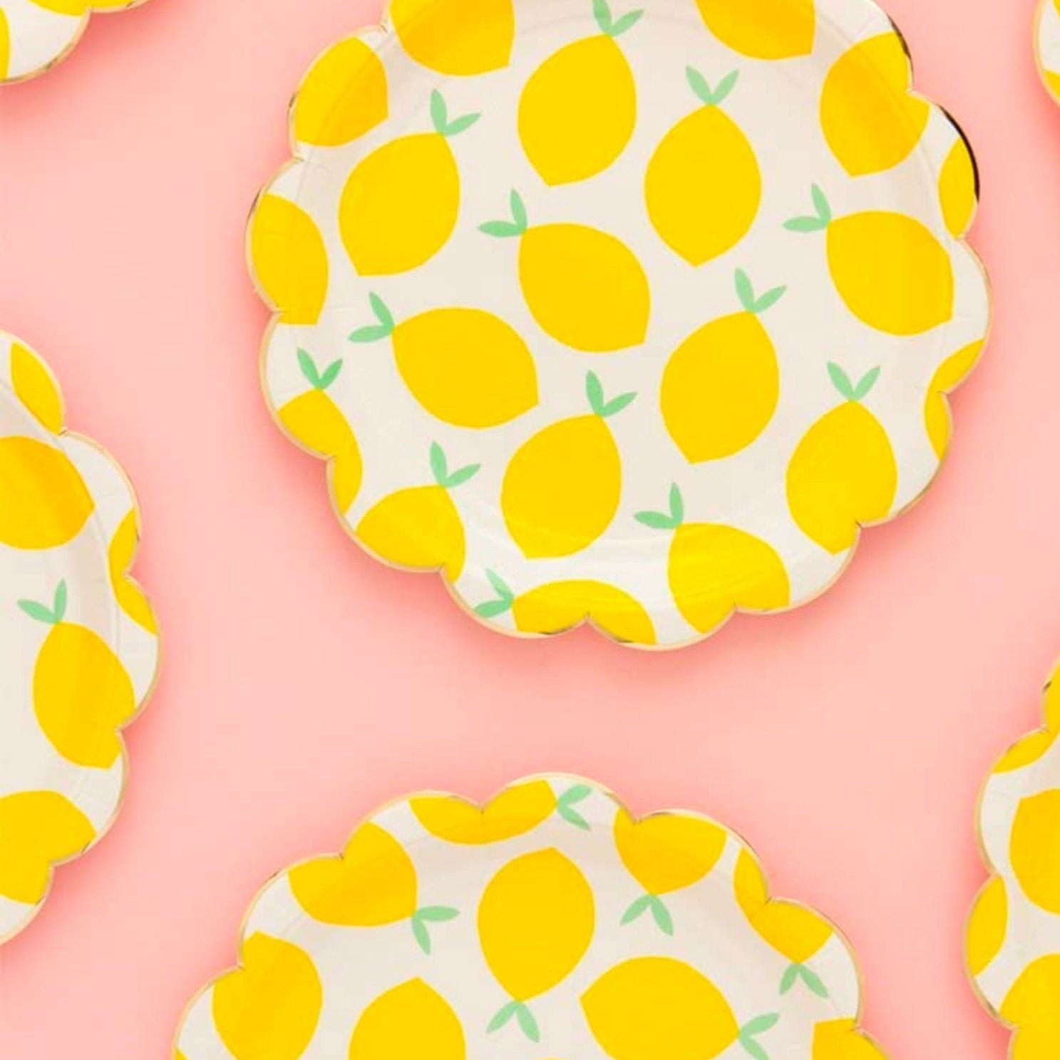 Lemon napkins folded with bright yellow citrus pattern for parties