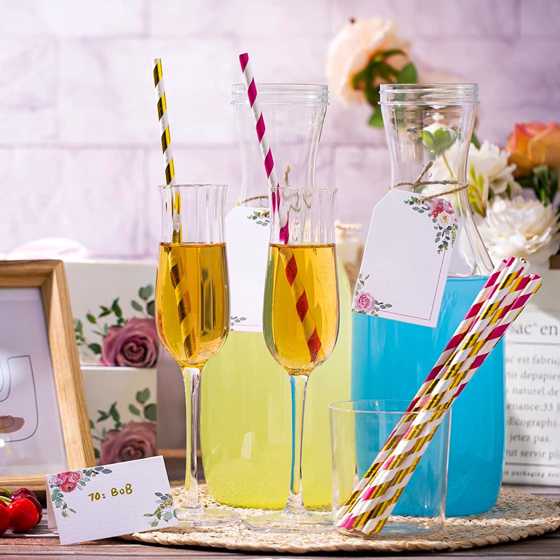 Brunch table styled with mimosa bar sign, banner, and decorated drink station