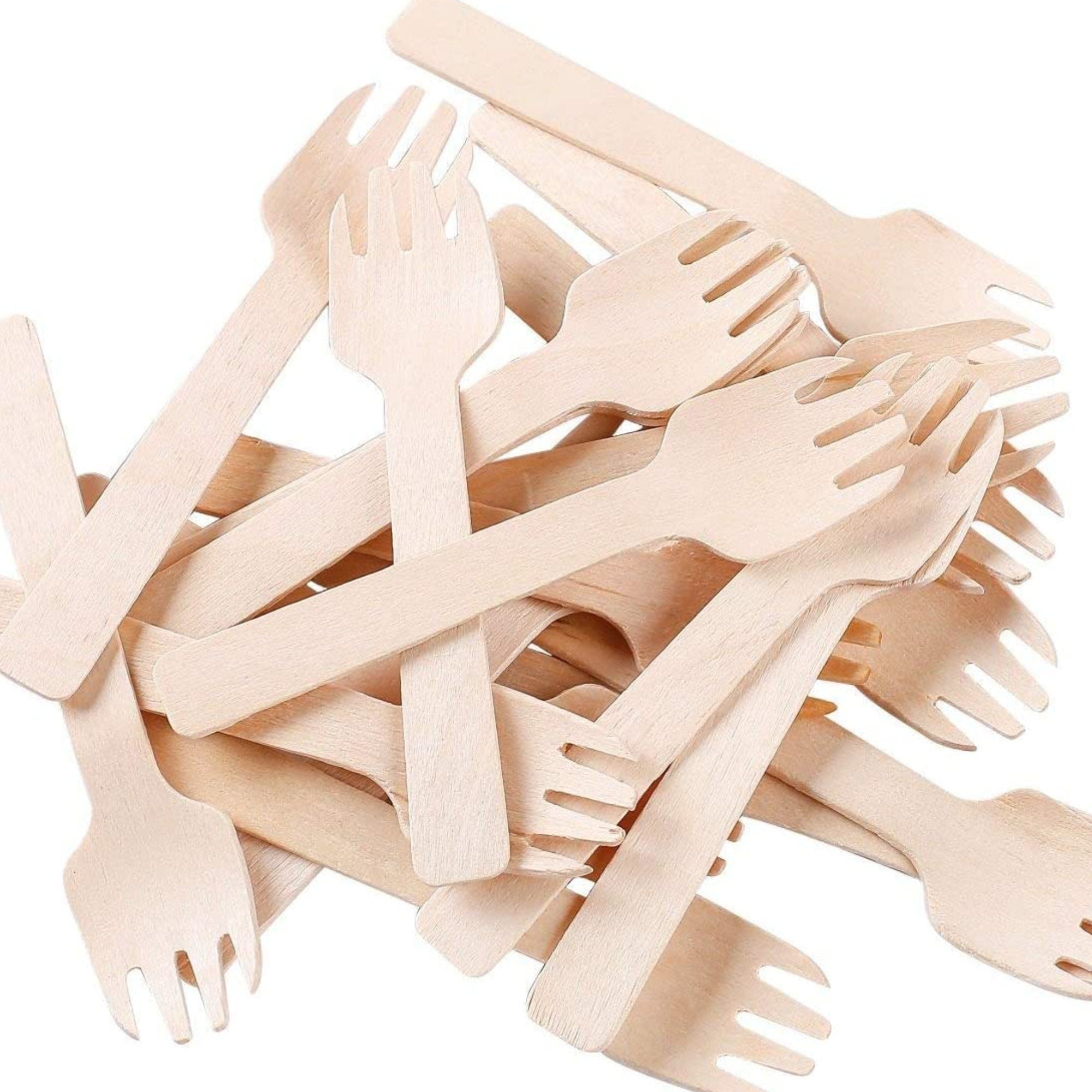 Pile of mini wooden forks eco-friendly disposable cutlery
