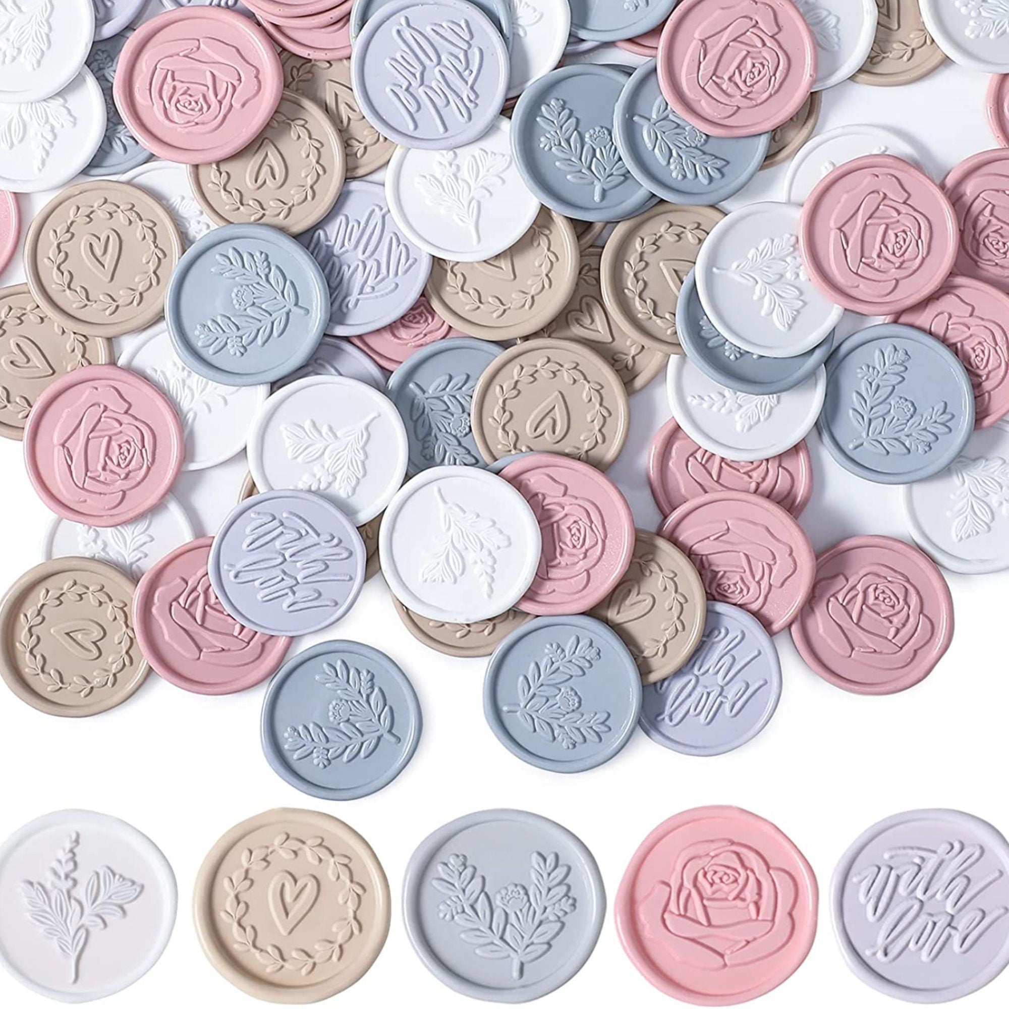Close-up pile of pastel peel-and-stick wax seal stickers in ivory, milk tea, pale blue, dusty rose and lilac.