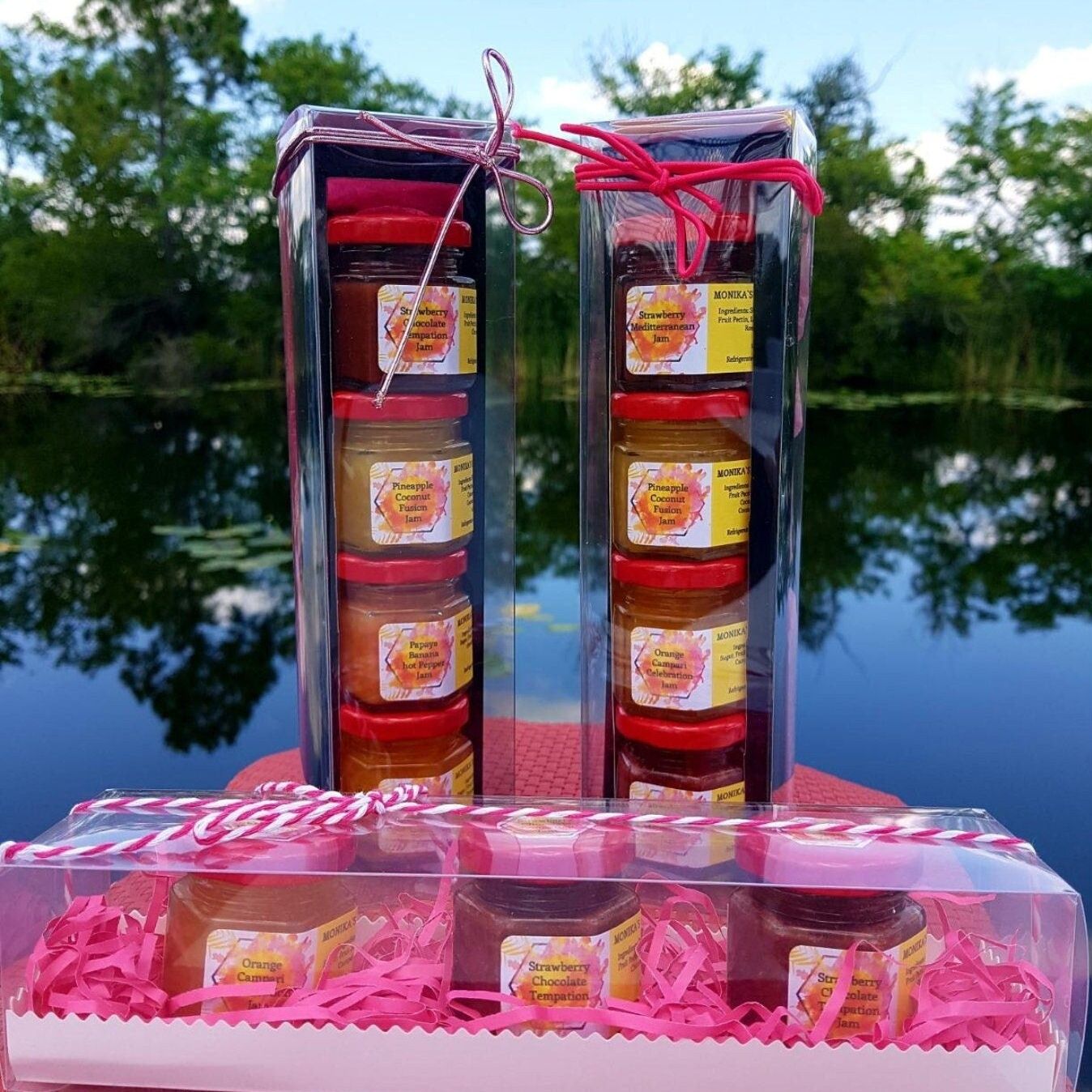 Packaged jelly jars with pink ribbon against a natural background