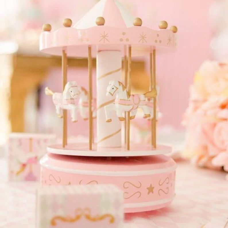 Pink carousel horse cake topper with LED lights and music
