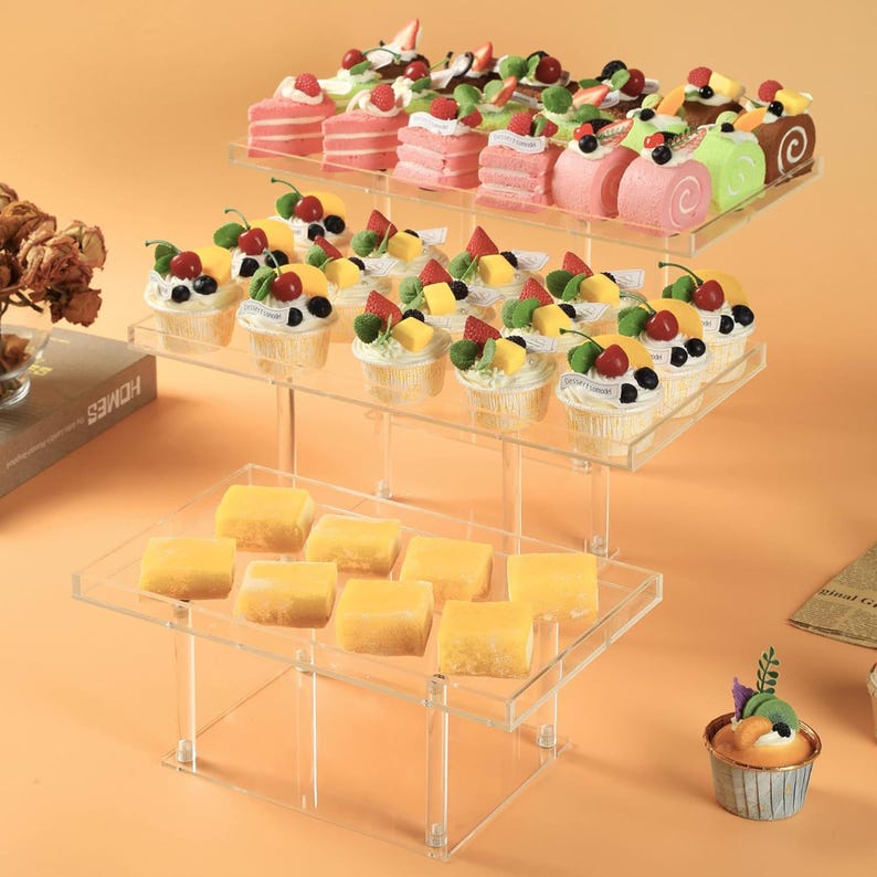 Close-up view of premium acrylic tiered display stand with food-safe surface