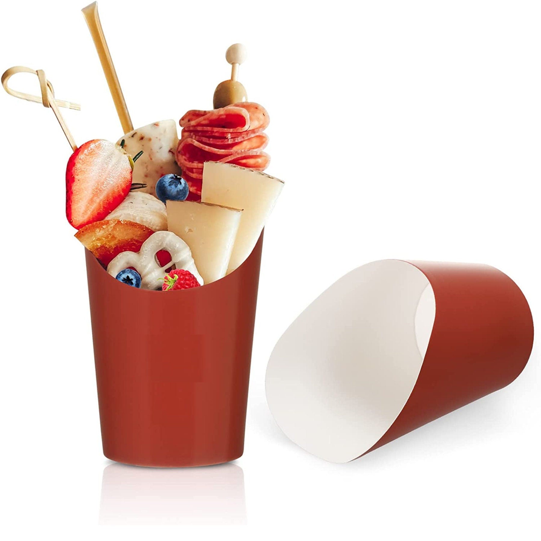 Red charcuterie cup filled with cheese, meats, strawberries, and snacks.