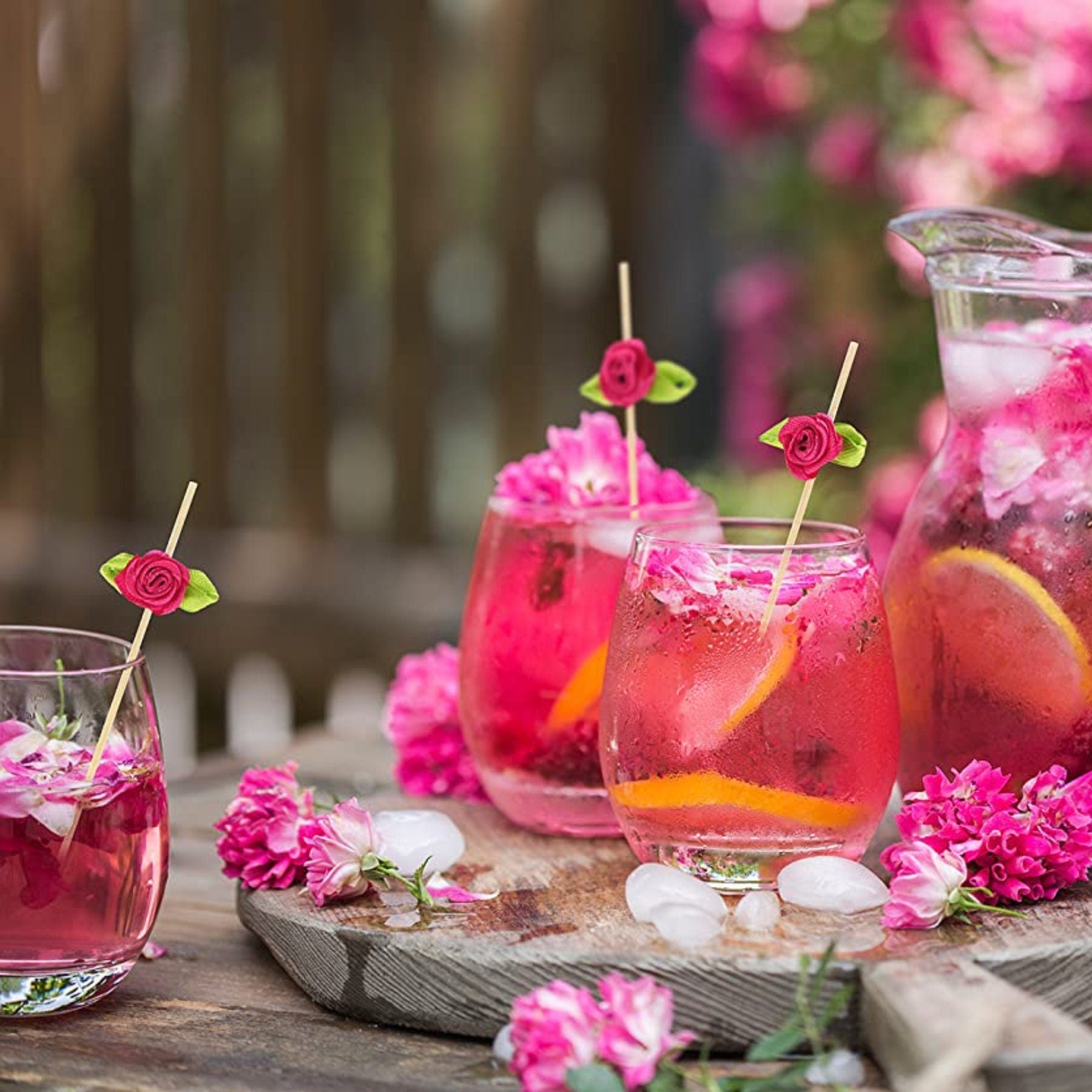 Floral charcuterie toothpicks decorating cocktails and drinks