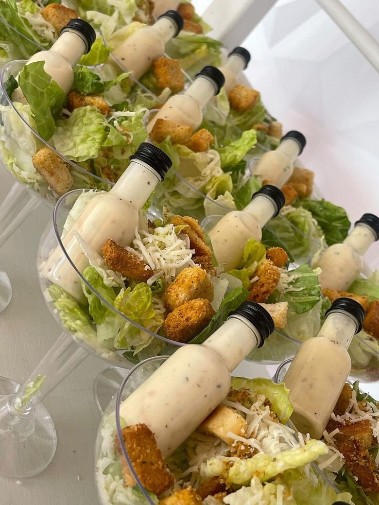 Salad in clear acrylic salad cups