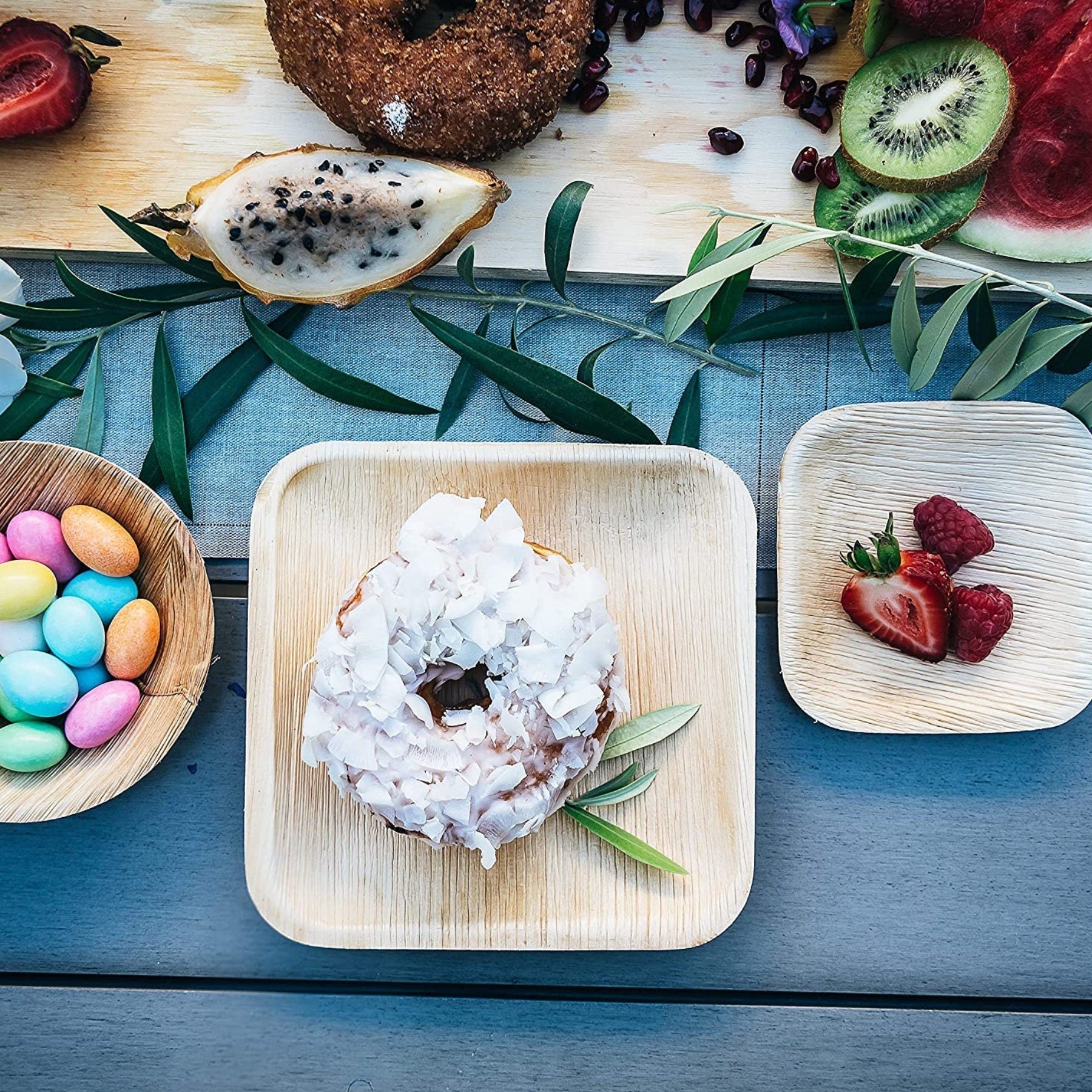 Square bamboo appetizer plate with donut on a grazing table
