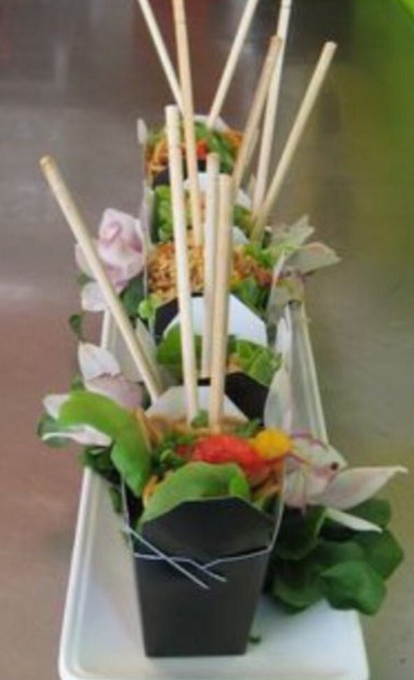 Party favor-themed mini Chinese food boxes with chopsticks.