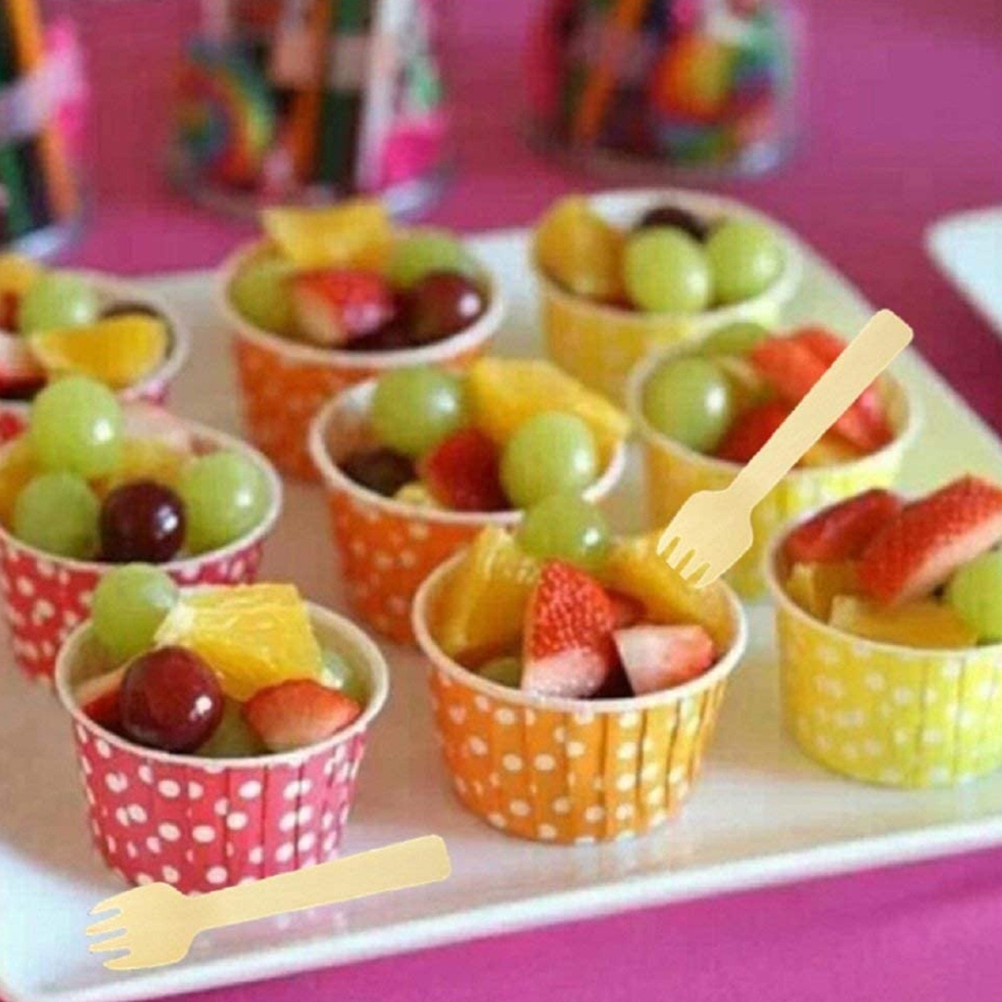 Wooden forks used with fruit cups at party event display