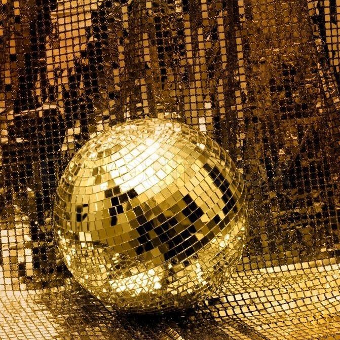 Mini gold disco balls from a 25-piece set, providing unique disco party decorations for baby showers, birthdays, or other celebrations.