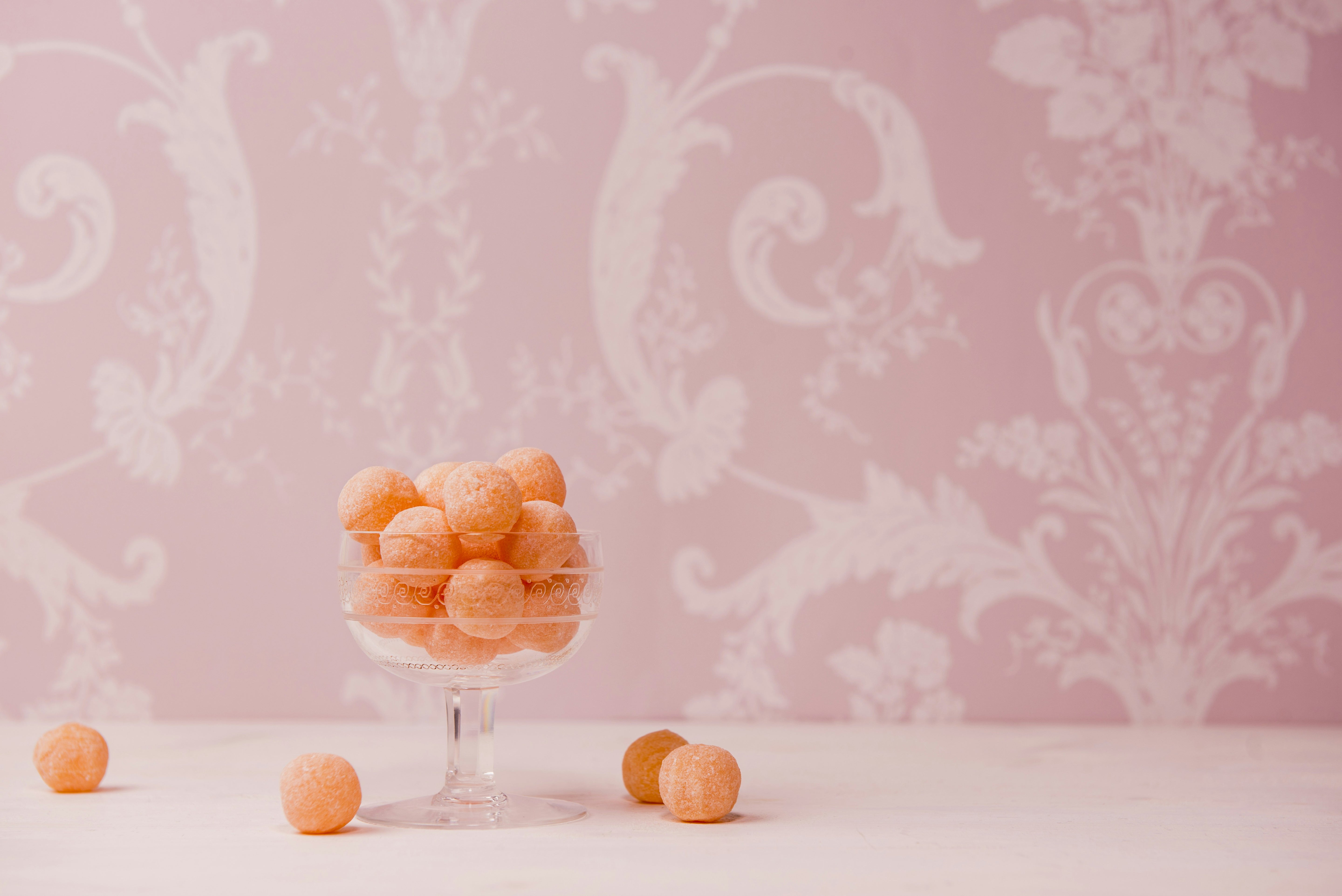 Baby shower party favors and charcuterie cups arranged on a decorative table setup.