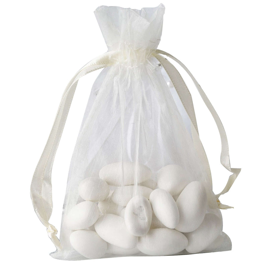 Elegant ivory organza drawstring gift bag filled with colorful candies – perfect for weddings, bridal showers, and special events