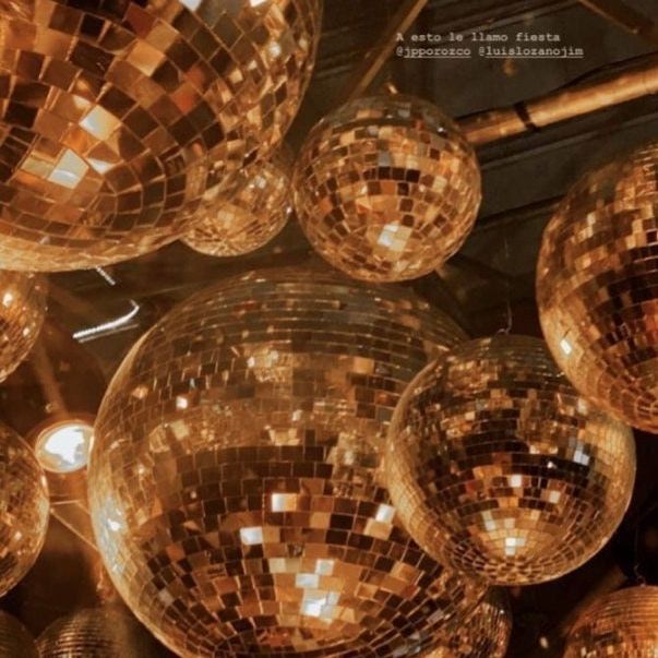 Bright gold disco balls in a 25-pack arrangement featuring assorted sizes, up to 4 inches, for vibrant disco party decorations.