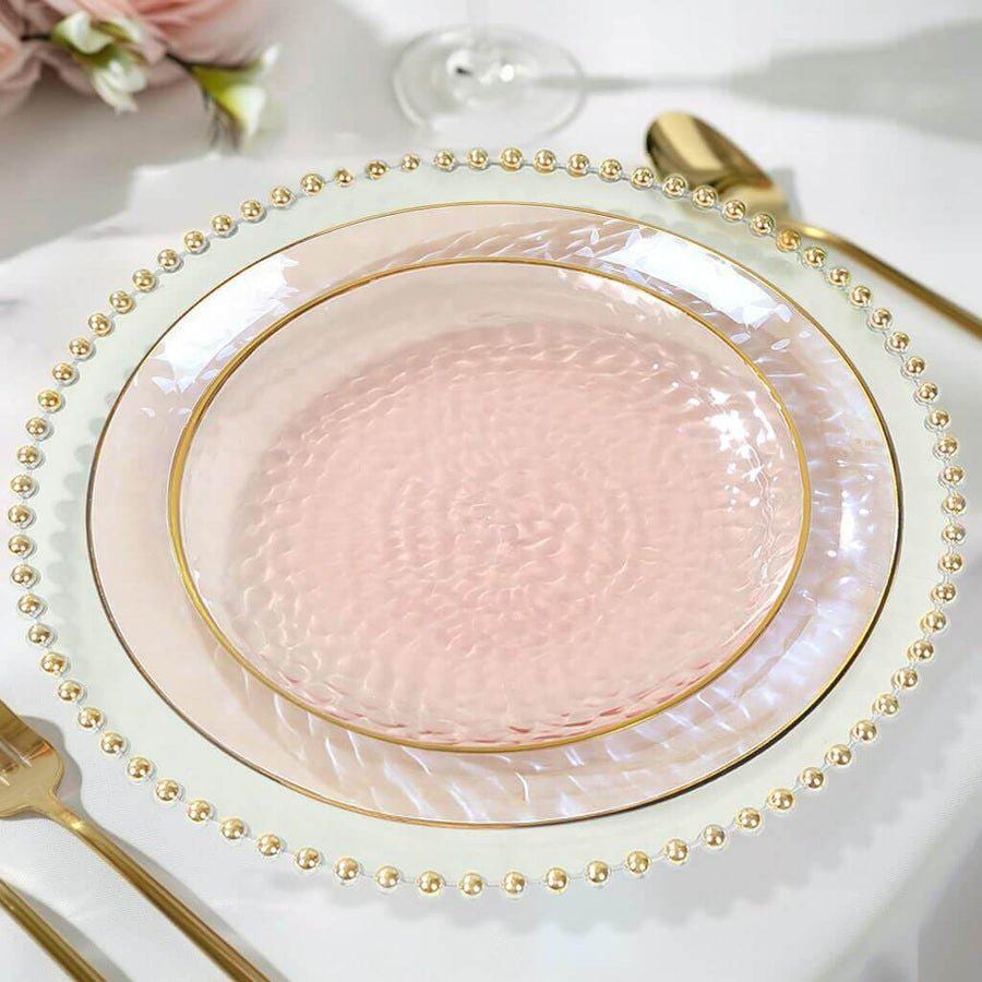 9 inch ivory hammered plastic dinner plate with gold rim. Disposable tableware for large events.