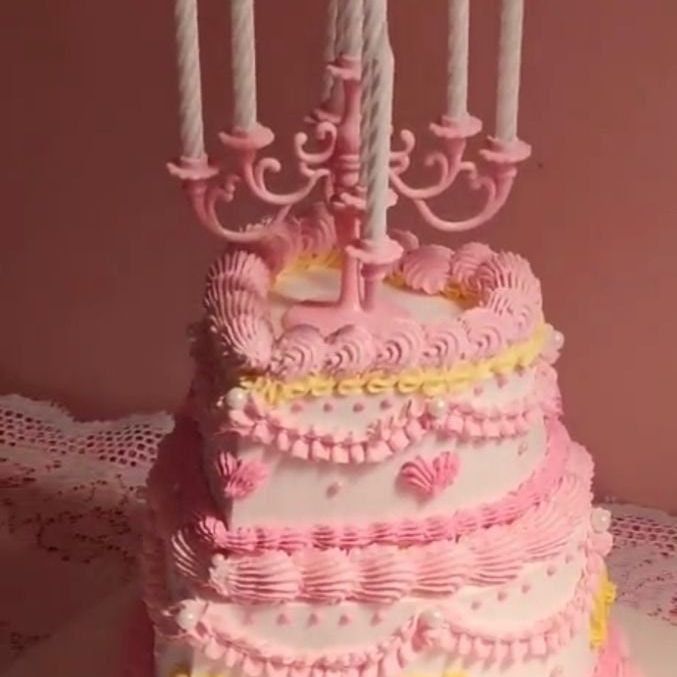 Clear plastic serving fork with an elegant gold handle. Disposable servingware for parties or appetizers.