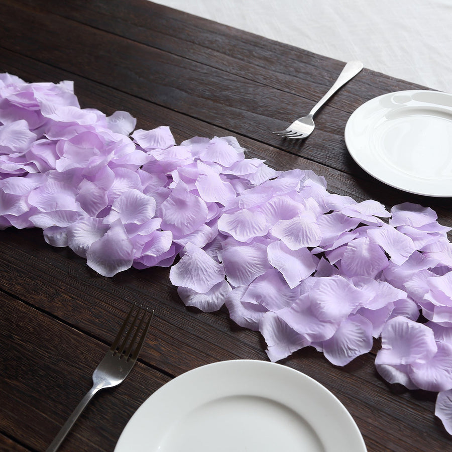 Decorative silk rose petals used in elegant event table settings