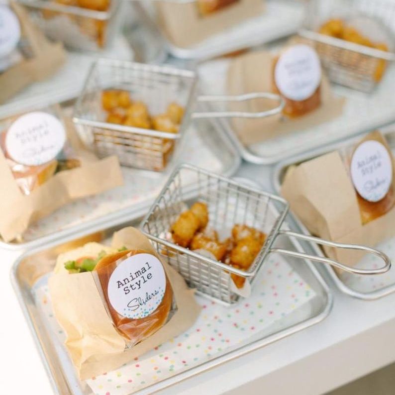 Close-up of mini fry basket with fries, showcasing metal finish