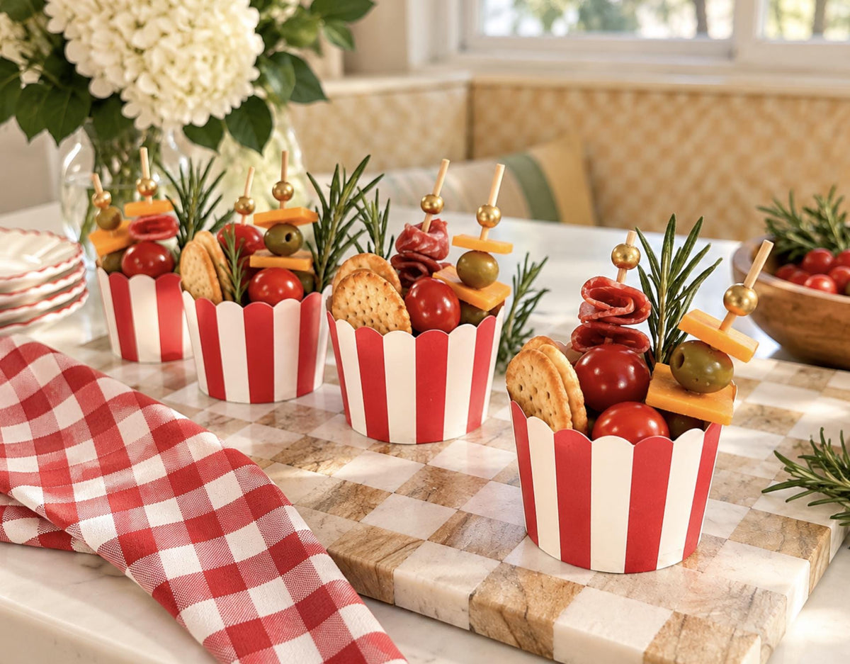 Close-up of charcuterie cup with meat, cheese, and crackers. Individual disposable wooden cone for catering.